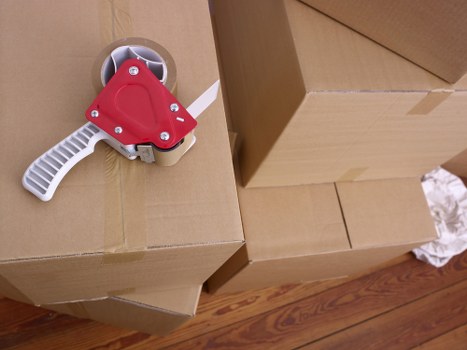 Professional movers handling furniture during a small removals service